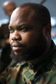 Close up of man working in army headquarters, tasked with enemy surveillance Stock Photos