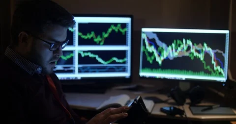 Close up of a man working concentrated with his tablet and graphs Stock Footage 88060612