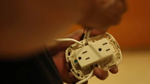 CLOSE UP OF A MAN WORKING IN A ELECTRIC INSTALLATION Video stock 107300564