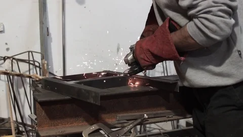 Close up of a man working with grinder tool - sparks flying Stock Footage 81858457