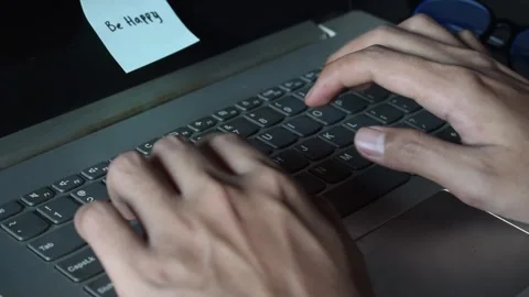 Close up man working with this laptop and get motivation sticky note with word Stock Footage 287782737