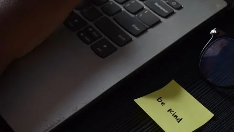 Close up man working with this laptop and get motivation sticky note with word Stock Footage 287782763