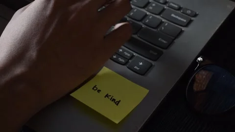 Close up man working with this laptop and get motivation sticky note with word Stock Footage 287783027
