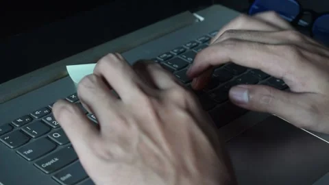 Close up man working with this laptop and get motivation sticky note with wor Stock Footage 287783073