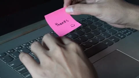Close up man working with this laptop and get motivation sticky note with wor Stock Footage 287783149