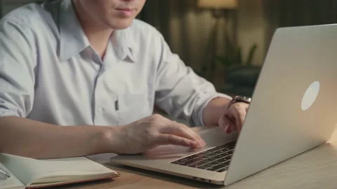 Close Up Man Working With Laptop Compter At Home Overtime At Night Stock Footage 154917672