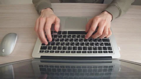 Close up Man is working on a laptop computer at home. Stock Footage 102278650
