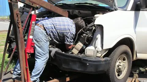 Close-up -  man working on truck Stock Footage 11476277