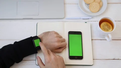 Close up of Man Working Using Smartwatch Connected to Phone. Stock Footage 116613883