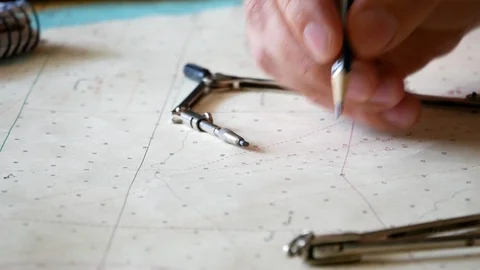 Close up of a man that works with compass and map Stock Footage 129082980