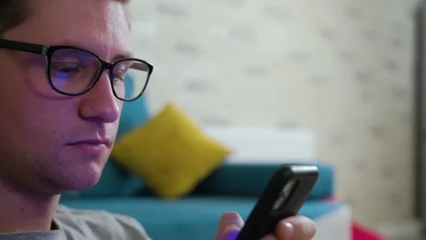 Close up of a man write a message using a mobile phone, staying isolated at home Stock Footage 144686450