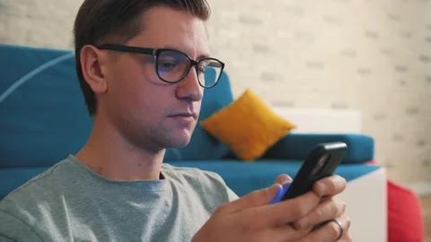 Close up of a man write a message using a mobile phone, staying isolated at home Stock Footage 145122342