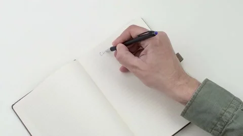 Close up of man writing on a notebook. Stock Footage 154198373