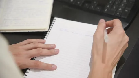 Close up of man writing with pen in notebook. Stock Footage 134943095