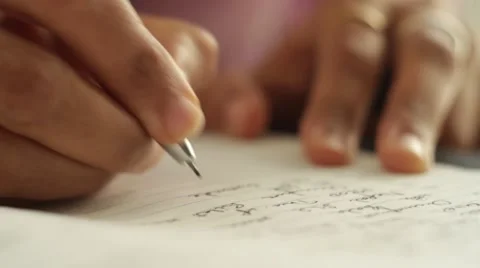 Close up of a man writing a proposal with a pen Stock-Footage 55546673