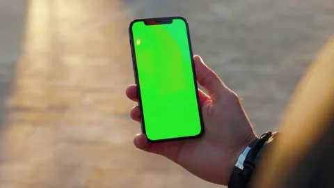 Close up man young hand using touch phone with vertical green screen background Stock Footage 145850845