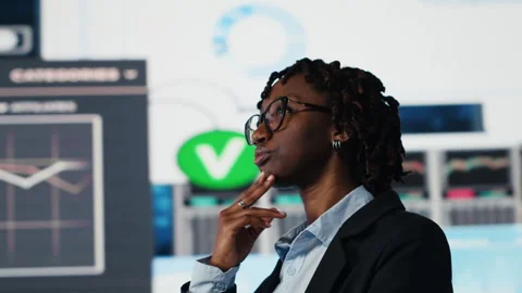 Close up of management executive comparing company metrics on digital videowall Stock Footage 318624890