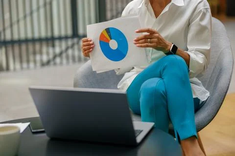 Close up of manager showing documents to colleagues during online meeting Stock Photos