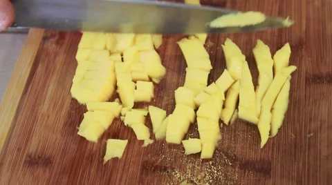 Close-up of a mango being cut into pieces Stock Footage 45274701