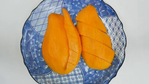 Close up mango fruit on blue plate. Stock Footage 128669503