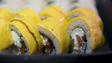 Close-up, mango sushi set on white clay plate Stock Footage 295310373