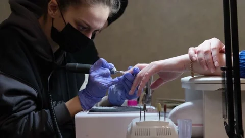 Close-up manicure master works in nail salon. Stock Footage 235043694