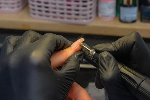 Close-up manicure process, female hands painting nails Stock Photos