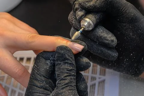 Close-up manicure process, female hands painting nails Stock Photos