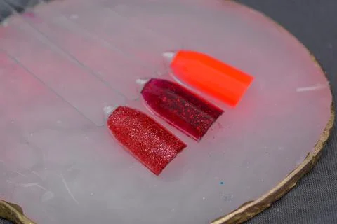 Close-up manicure process, female hands painting nails Stock Photos