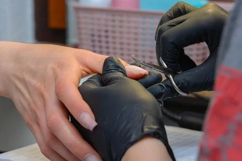 Close-up manicure process, female hands painting nails Stock Photos