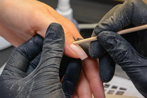 Close-up manicure process, female hands painting nails Stock Photos
