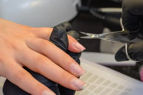 Close-up manicure process, female hands painting nails Stock Photos