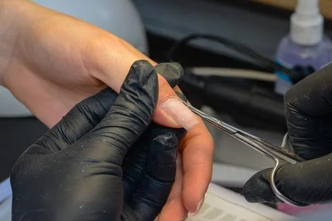 Close-up manicure process, female hands painting nails Stock Photos