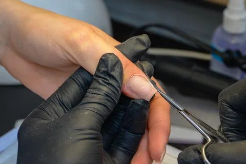 Close-up manicure process, female hands painting nails Stock Photos