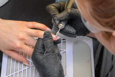 Close-up manicure process, female hands painting nails Stock Photos