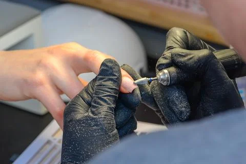 Close-up manicure process, female hands painting nails Stock Photos