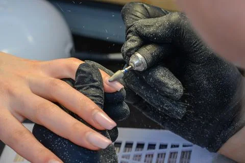 Close-up manicure process, female hands painting nails Stock Photos