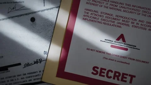 Close up on manila folder with official coversheet of secret information Stock Footage 316317666