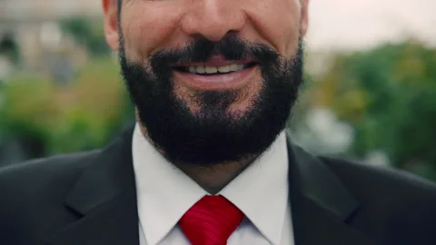 Close-up of a man's chin, an elderly man with a beard, standing in the street Video stock 165222717