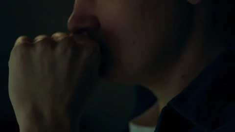 A close-up of the man's emotions on his face clearly reflects his concentrat Stock Footage 323709680
