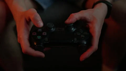 Close-up of a man's emotions while playing a video console Stock Footage 220056166