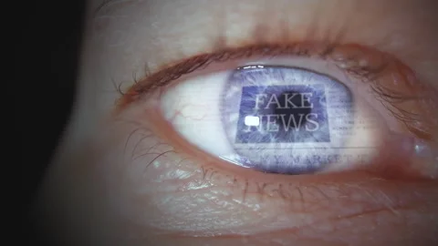Close up of man's eye reading Fake news headline in fast loop. False or 스톡 동영상 286139043