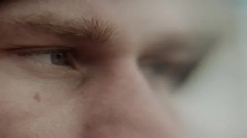 Close-up of a man's eye. Slow motion video 4K Stock Footage 317214936