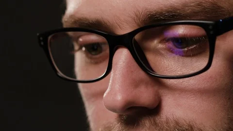 Close-up of a Man's Face Against a Black Background Stock Footage 88453540