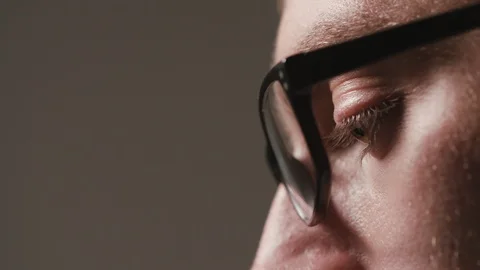 Close-up of a Man's Face Against a Black Background Stock Footage 88453919