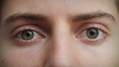 Close up of Man's face. Attractive boy opening his beautiful blue eyes. Video stock 142909421