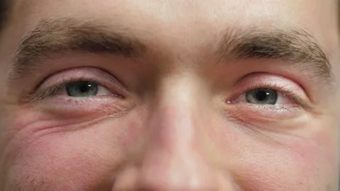 Close up of Man's face. Attractive boy smiling with his beautiful blue eyes. Stock Footage 165207007