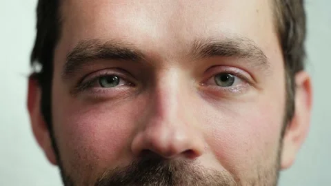 Close up of Man's face. Attractive boy smiling with his beautiful blue eyes. Stock Footage 165208125