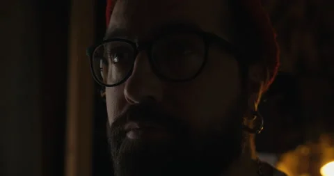 Close-up of a man's face with glasses. dramatic shot. cinematic shot Stock Footage 219831724