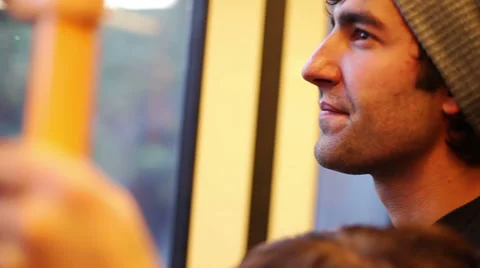 Close up of a man's face as he rides the train Video stock 33873641